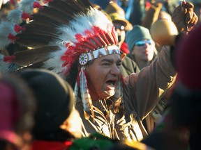 Native American activists celebrate after learning an easement had been denied for the Dakota Access Pipeline at Oceti Sakowin Camp on the edge of the Standing Rock Sioux Reservation on December 4, 2016 outside Cannon Ball, North Dakota.