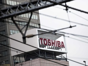 Toshiba Corp shares close down 20% following a 12% drop Tuesday after the company said it have to write billions on its U.S. nuclear reactor unit.