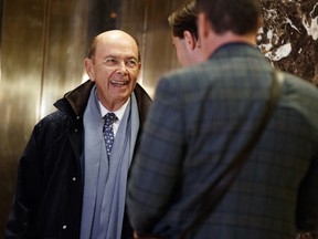 Billionaire investor Wilbur Ross waits for an elevator in the lobby of Trump Tower, Tuesday, Nov. 29, 2016, in New York. Ross is the new Secretary of Commerce.