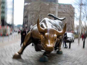 The famous bull sculpture stands near Wall Street in New York, U.S., on Friday, Feb. 12, 2016.