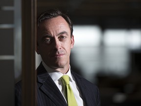 Kevin McCreadie, president and chief investment officer of AGF Investments Inc., poses for a portrait at his office in Toronto, Monday July 13, 2015.