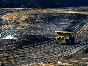 A 400-ton heavy hauler truck makes its way across Shell Albian Sands' Jackpine Mine pit #10, north of Fort McMurray, Alta.