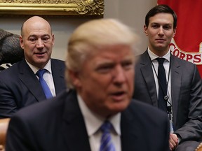Director of the National Economic Council Gary Cohn (L) and Senior Advisor Jared Kushner (R) listen to U.S. President Donald Trump deliver opening remarks during a meeting with business leaders in the Roosevelt Room at the White House January 23, 2017 in Washington, DC.