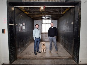 Flip Accounting's Mike MacDonald, left, and Matt Hicks at their Toronto offices, with pooch Seamus.