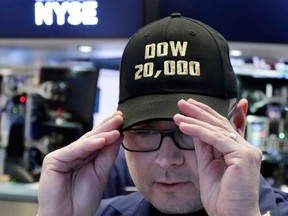 The Dow Jones Industrial Average is staying firmly above 20,000 today, after breaching the milestone a day earlier, while losses in tech stocks weighed on the S&P 500 and the Nasdaq Composite indexes.