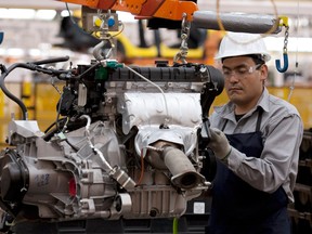 An employee works in one of Ford Motor Co’s plants