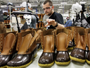 An employee stitches L.L. Bean's iconic boots.
