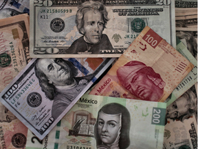 Bank notes of Mexican pesos and U.S. dollars. Long-time currency whiz John Taylor is predicting a big run the American currency.