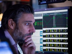 The Dow Jones Industrial Average declined on Monday, weighed down by banks and energy companies, while a gain in technology stocks kept the Nasdaq afloat.