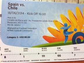 This June 4, 2014 photo shows a $90 U.S. dollar FIFA ticket for the Spain vs. Chile World Cup game, bought by a fan on Stubhub.com, a website that connects buyers and sellers, for $775 U.S. dollars, in San Juan, Puerto Rico. StubHub plans to beef up its operations north of the border this year with the launch of a Canadian website, French-language services and the ability to buy and sell tickets in Canadian currency.