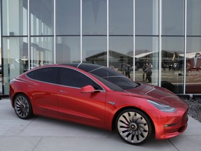 A Tesla Motor Inc. Model 3 vehicle is displayed outside the company's Gigafactory in Sparks, Nevada, U.S.