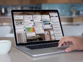 Trello's app displayed on a MacBook Pro.