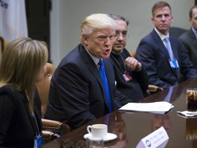 U.S. President Donald Trump, second left, speaks during a meeting with Mary Barra, chief executive officer of General Motors Co. (GM), left, and Sergio Marchionne, chief executive officer of Fiat Chrysler Automobiles NV, second right