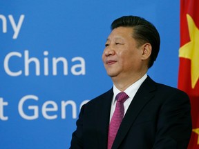 Chinese President Xi Jinping stands at the United Nations European headquarters in Geneva, Switzerland.