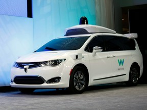 A customized Chrysler Pacifica Hybrid that will be used for Google's autonomous vehicle program on stage at the 2017 North American International Auto Show