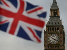 A Union flag flies near the The Elizabeth Tower, commonly known Big Ben