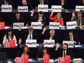 Members of the European Parliament vote in favour of the EU-Canada Comprehensive Economic and Trade Agreement (CETA) at the European Parliament in Strasbourg, eastern France, on Wednesday.