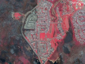 This photo provided by DigitalGlobe shows a satellite image of Fort McMurray in Alberta, Canada, on  May 5, 2016, in the aftermath of the massive wildfire.