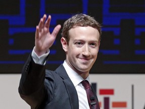 Mark Zuckerberg, chairman and CEO of Facebook, waves at the CEO summit during the annual Asia Pacific Economic Cooperation (APEC) forum in Lima, Peru