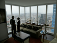 Jerry Dodson and his wife Pat stand inside their home on the 42nd floor of the Millennium Tower in San Francisco.