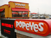 Signage is displayed outside a Popeyes Louisiana Kitchen Inc. fast food restaurant in Jeffersonville, Indiana, U.S.