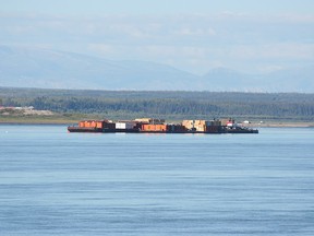 Barges are shown on the Mackenzie River near Norman Wells, N.W.T., in this undated handout photo.