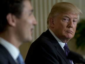 U.S. President Donald Trump, listens as Justin Trudeau, Canada's prime minister, left, speaks during a news conference