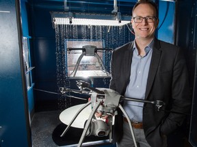 Aeryon's vice-president of product David Proulx with a couple of the company's drones.