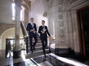 Bill Morneau and Justin Trudeau leave the PM's office on budget day.