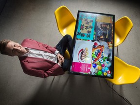 Dan McCann, president of Kodisoft, with one of the interactive table displays
