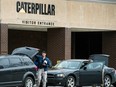 Federal officials execute a search warrant at the Caterpillar, Inc. facility in Morton, Ill., one of three Caterpillar facilities they are searching in the Tri-County area Thursday.