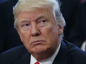 President Donald Trump listens to speakers in the Oval Office of the White House in Washington, Tuesday, March 21, 2017.