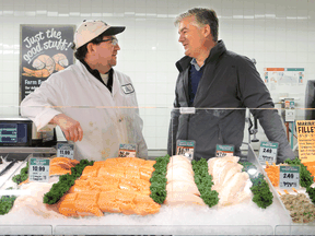 Farm Boy CEO Jeff York, right, chats with meat supervisor Steve Nagy at a Farm Boy store in Ottawa.