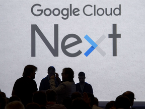 The silhouettes of attendees are seen arriving for the Google Inc. Cloud Next '17 event in San Francisco, California.