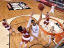 Kentucky's Karl-Anthony Towns (12) drives to the basket past Wisconsin's Frank Kaminsky (44) during the first half of the NCAA Final Four national semifinal college basketball game in 2015