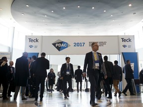 Attendees walk through the Metro Toronto Convention Centre during the 2017 Prospectors & Developers Association of Canada (PDAC) convention in Toronto, Ontario, Canada, on Monday, March 6, 2017. The prospect of increased deal-making is set to be a hot topic for the more than 20,000 geologists, promoters and investors expected to attend the four-day PDAC convention, the world's biggest mining gathering.