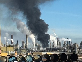 A plume of smoke hangs over the Syncrude Canada Mildred Lake Upgrader near Fort McMurray on March 14