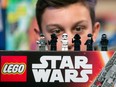 A child looks at Lego figurines from the Star Wars 'Kylo Ren's Command Shuttle', manufactured by Lego A/S, as it sits on display at the Toy Retailers Association DreamToys.