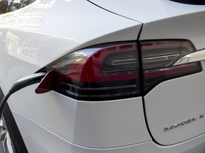 A Tesla Model X electric SUV charging in Washington, DC.