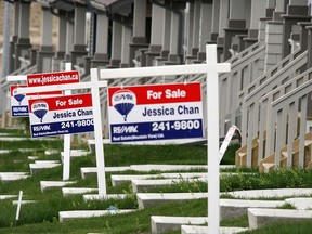 Real estate sales are down from last year in Calgary. These signs are in various northeast communities.