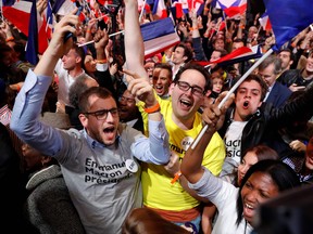 Supporters of French presidential election candidate for the En Marche ! movement celebrate Sunday.