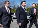 Federal Finance Minister Bill Morneau (right) Provincial Finance Minister Charles Sousa (centre) and Toronto Mayor John Tory leave a meeting after talks on housing market in the Greater Toronto Area