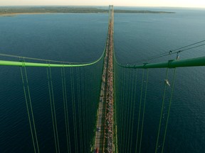 Officials are questioning the safety of two Enbridge Inc., pipelines that carry oil beneath the waterway linking Lakes Huron and Michigan.