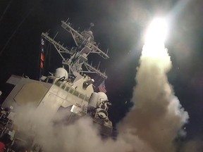 In this handout provided by the U.S. Navy, the guided-missile destroyer USS Porter fires a Tomahawk land attack missile on April 7, 2017 in the first direct U.S. assault on Syria and the government of President Bashar al-Assad in the six-year war there.
