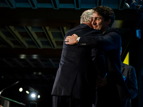 Prime Minister Justin Trudeau awards Dominic Barton, Global Managing Partner at Mckinsey and Company.