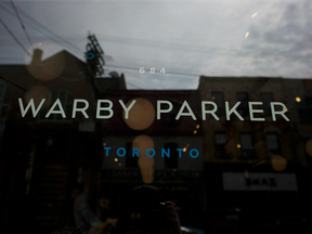 Signage is shown on the front of U.S. based eyewear boutique Warby Parker's flagship Toronto store