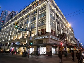 Pedestrians walk past a Hudson's Bay Co. store in downtown Vancouver, British Columbia, Canada, on Wednesday, Jan. 11, 2017.