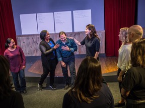 Kevin Frank, artistic drector of training and education for Second City Canada, centre, and Christy Bruce, instructor, centre right, run a class in Toronto called RewireU.