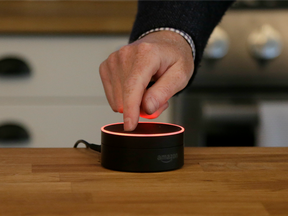 David Limp, Amazon Senior Vice President of Devices, pushes down on an Echo Dot in San Francisco.