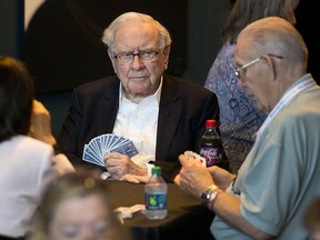 Warren Buffett, chairman and chief executive officer of Berkshire Hathaway Inc., plays bridge at an event on the sidelines the Berkshire Hathaway annual shareholders meeting in Omaha, Nebraska, U.S., on Sunday, May 7, 2017.